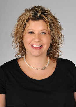 Libby Infinger, MD, MPH, Pediatric Neurosurgery wearing a black dress