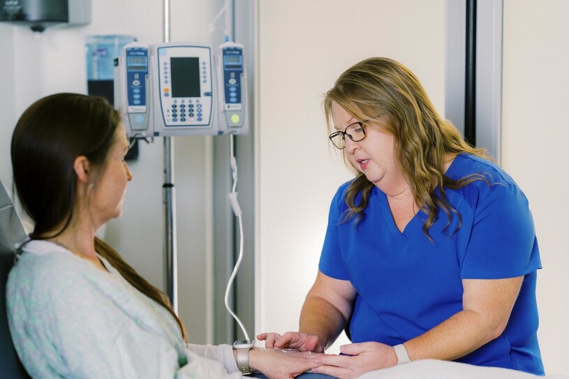 Kelly Rogers portraying a patient with Dustee Rivers as her nurse, both RN, Infusion-Chemo, at the infusion center at MUSC Health Lancaster Medical Center.