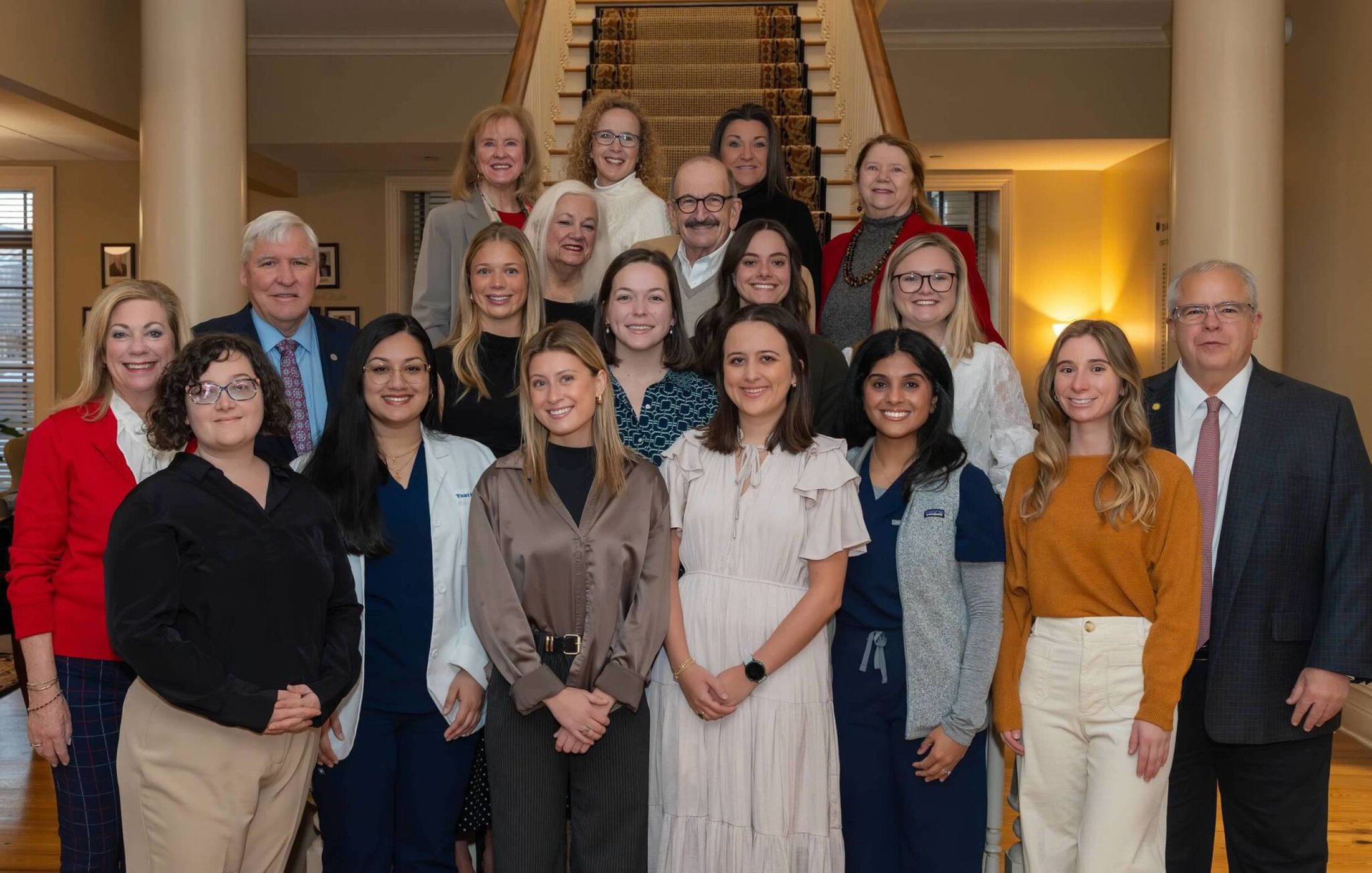 Medical University of South Carolina Women's Club Recipients 2026 taken in a home with recipients wearing dress clothes.
