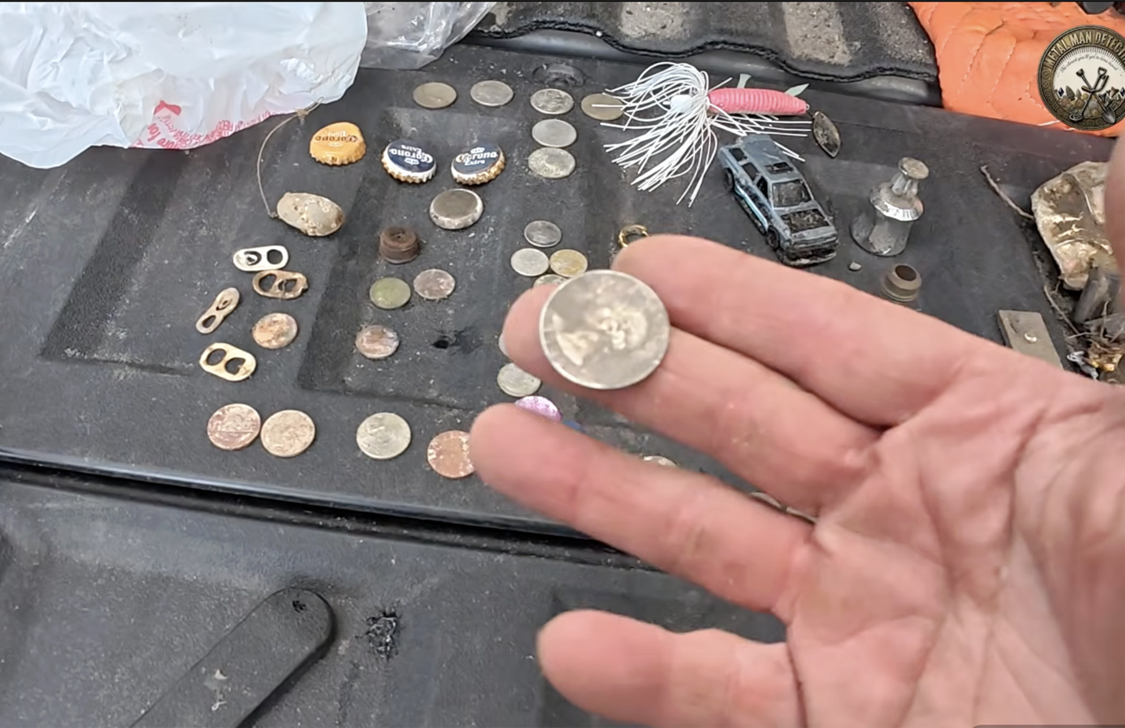 Kevin Campbell holds a 1946 quarter that he found in Georgetown.