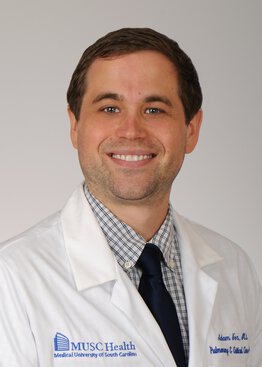 Adam Fox, MD, Pulmonary & Critical Care Medicine wearing a white coat