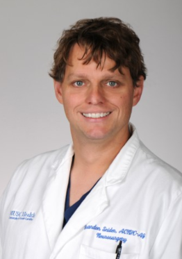 Brandon Snider - Neuro CC - NSICU wearing a white coat