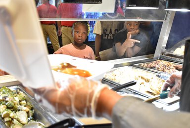 CREDIT/MUSC Health .Aamyri Blackwell, left, and Princeton Timmons look at the lunch options during the MUSC Kids Eat Free program at MUSC Health Marion Medical Center. The program provided free lunch to children 18 years and younger during the month of July.
