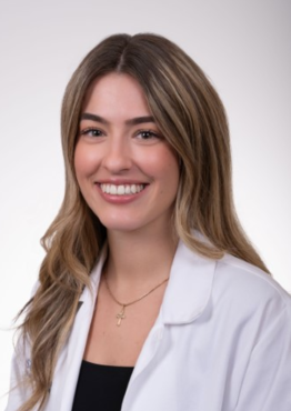 Claire Barry - Neuro CC - NSICU wearing a white coat