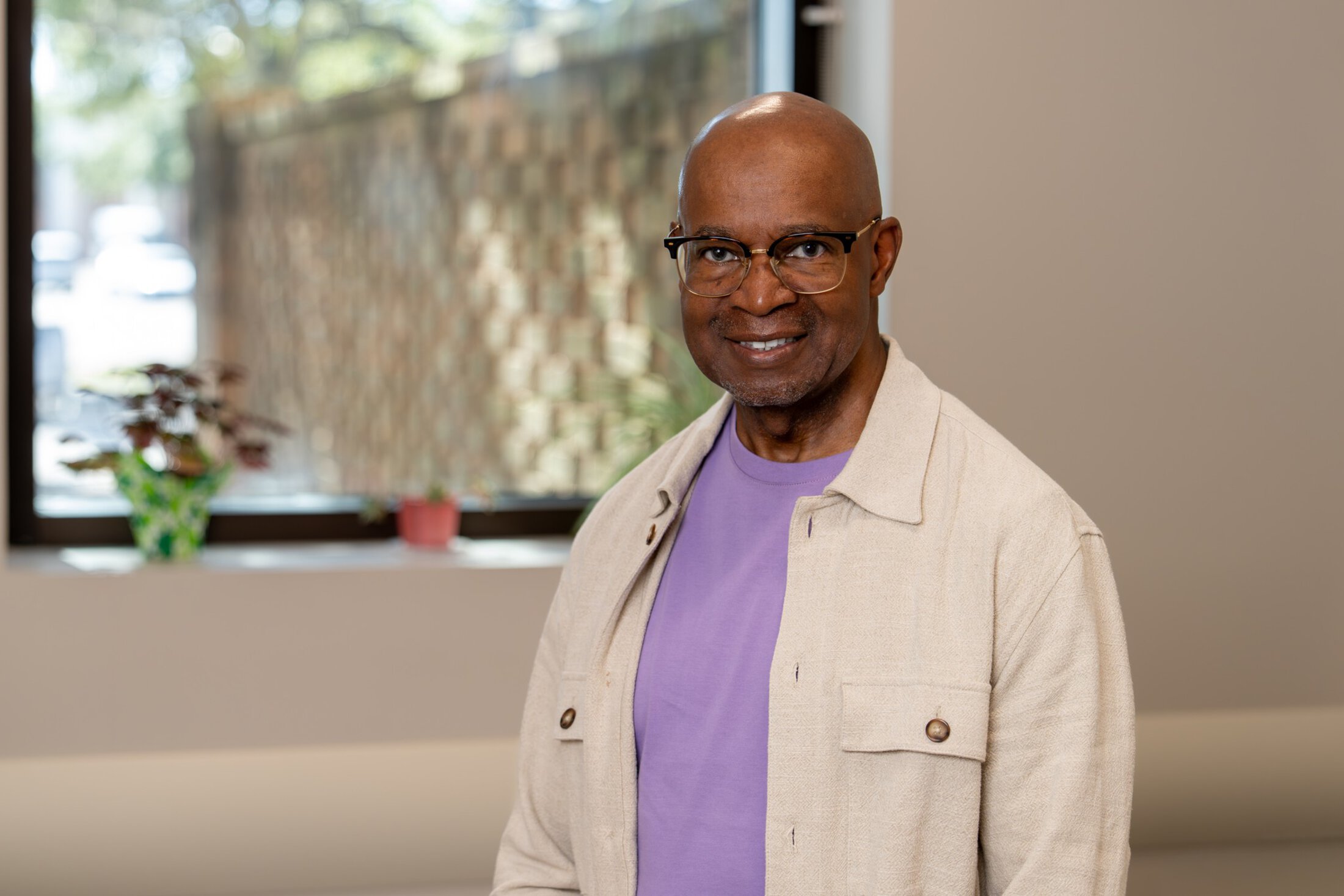 Kenneth Reid standing in an office at Hollings Cancer Center