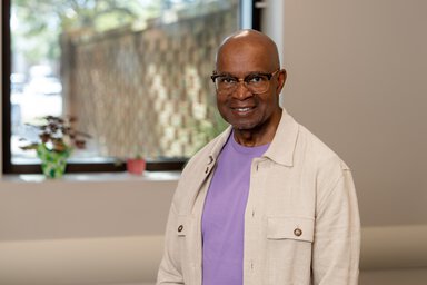 Kenneth Reid standing in an office at Hollings Cancer Center
