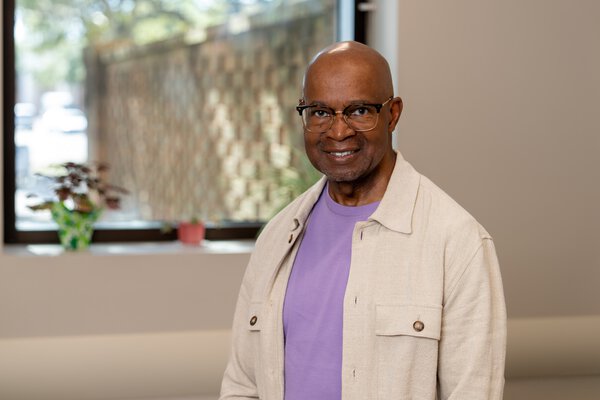 Kenneth Reid standing in an office at Hollings Cancer Center