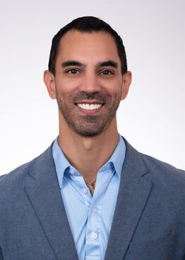 Ramin Eskandari, MD, MS, Pediatric Neurosurgery wearing a sport coat and blue dress shirt