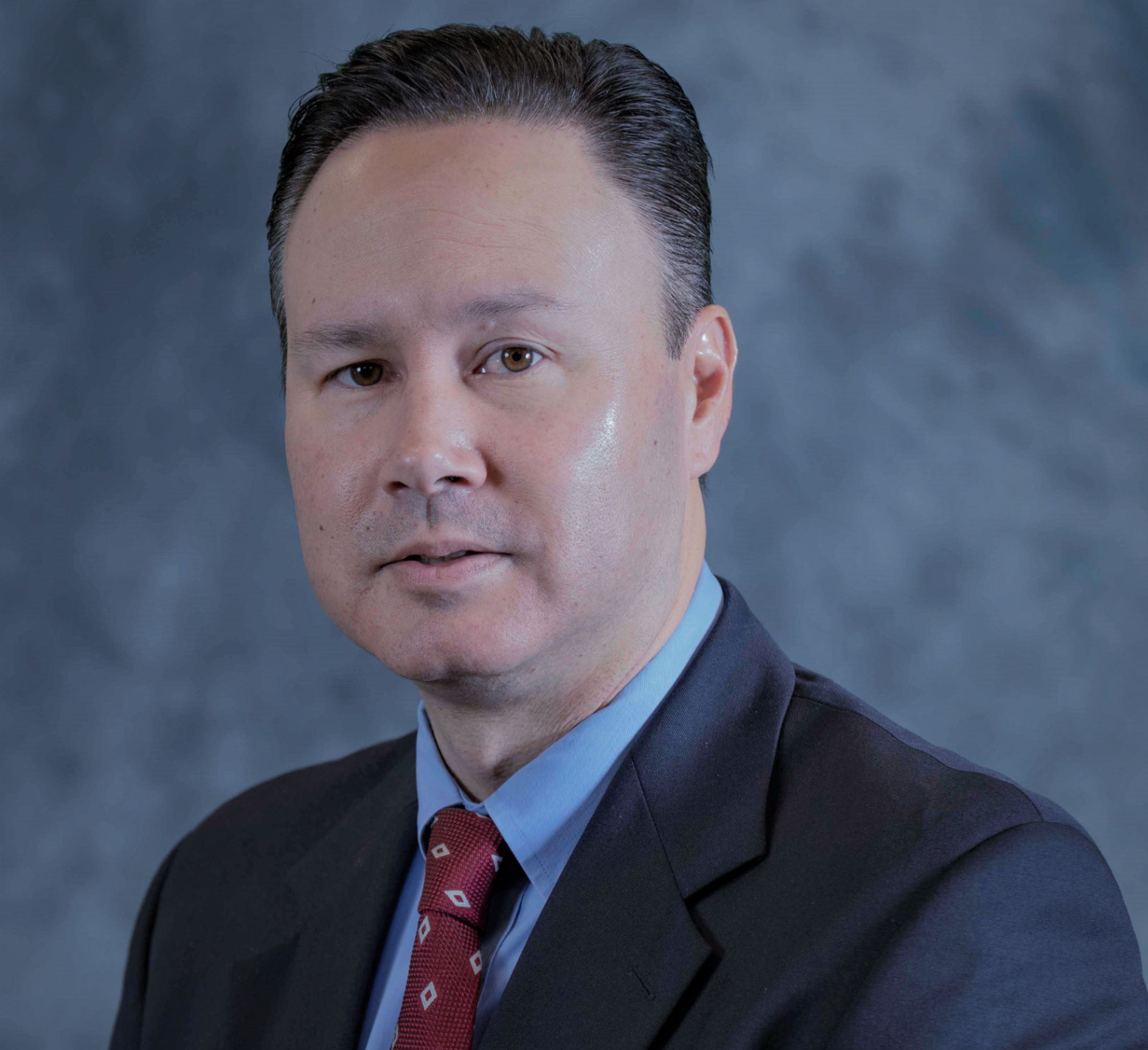 Tom Nesteruk CPO, wearing a suit