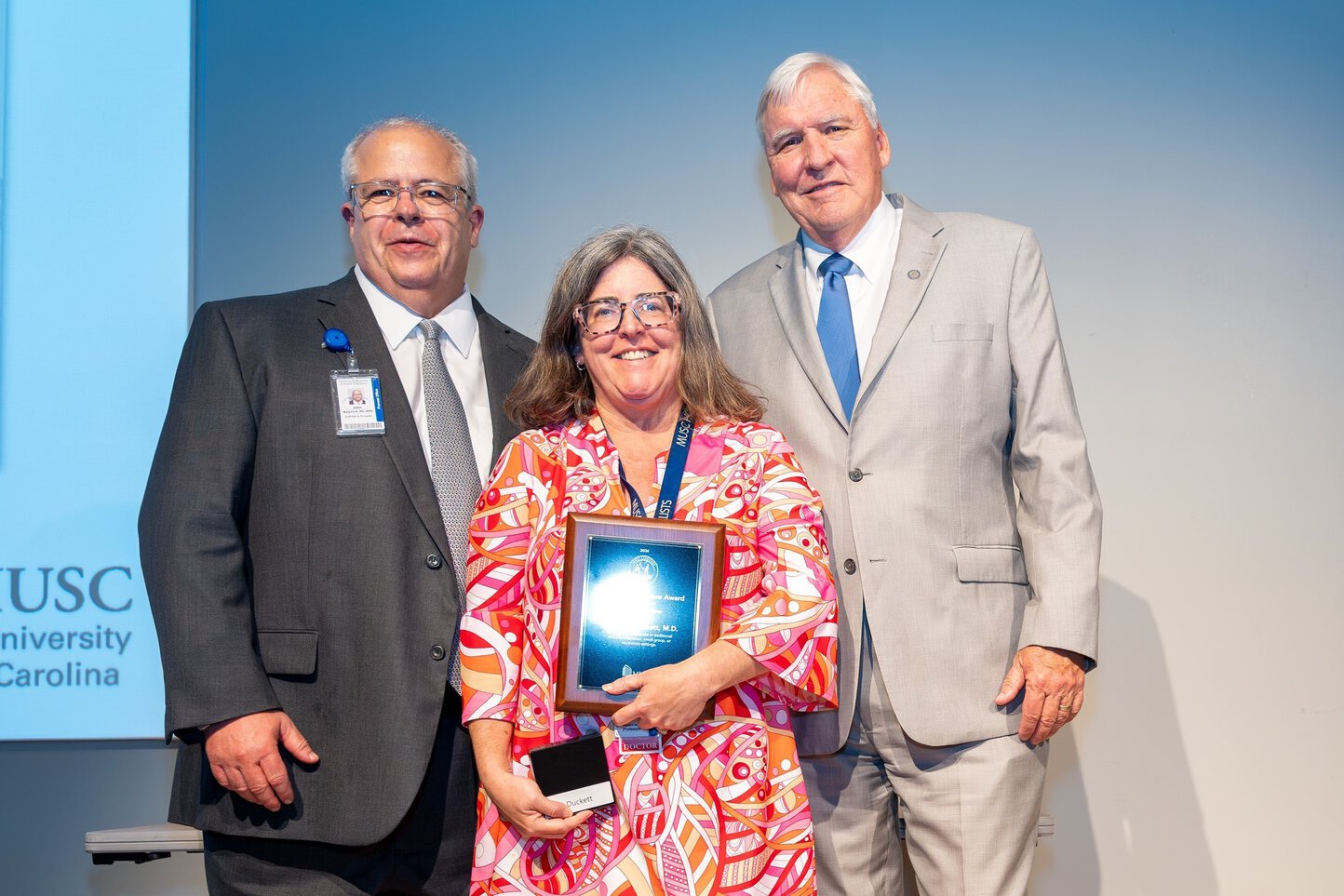Dr Duckett receiving her award.