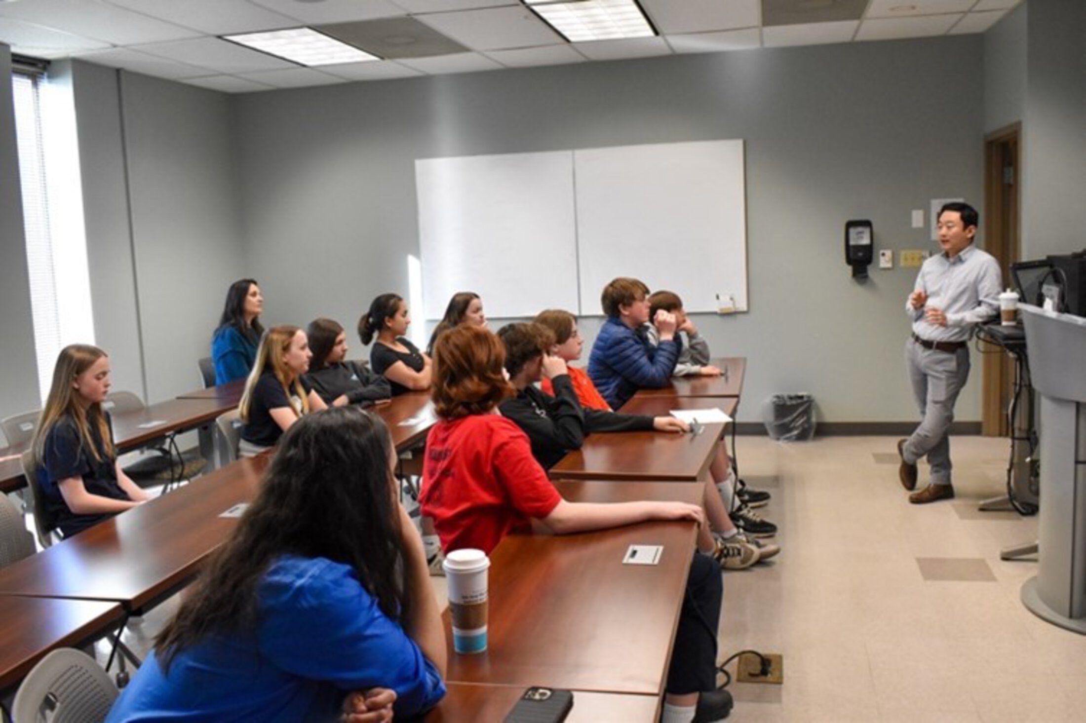 Lecture - Making Neuroscience Fun while a group of students listen to teacher