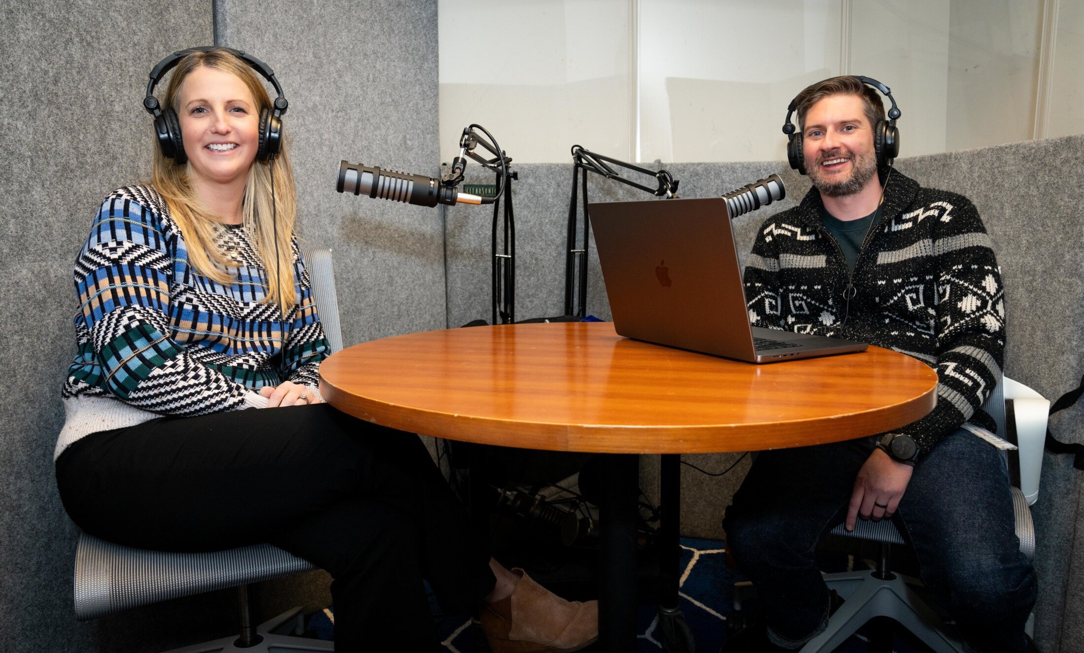 A woman and man in the CATL podcast studio recording an episode