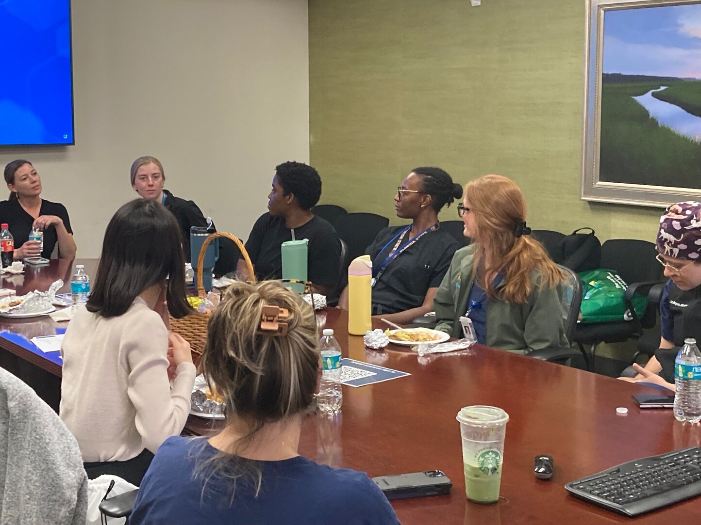 Residents and PRIME Team having lunch with visiting students in the AHEAD program