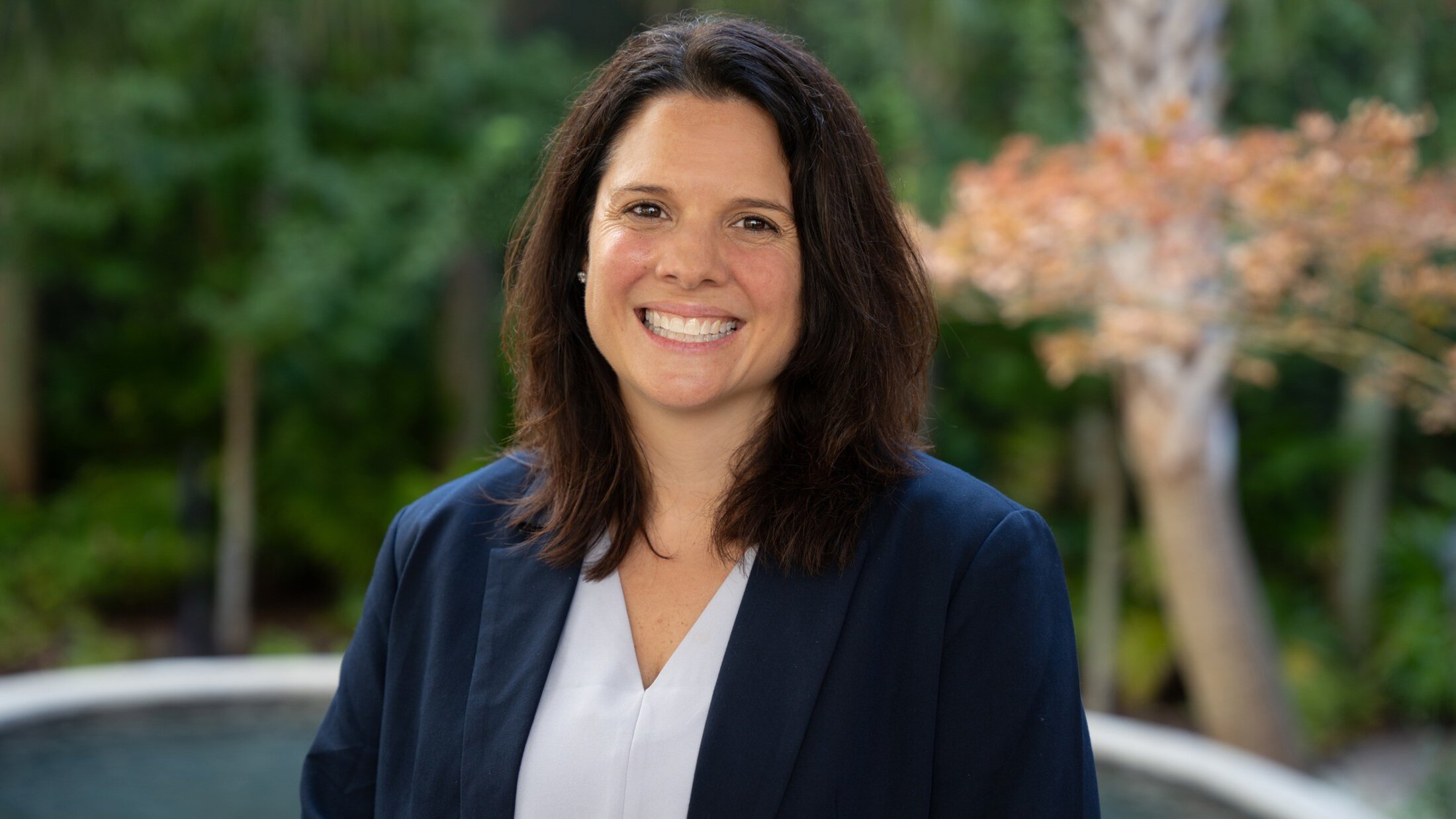 headshot of Michelle Mollica in a navy blue blazer