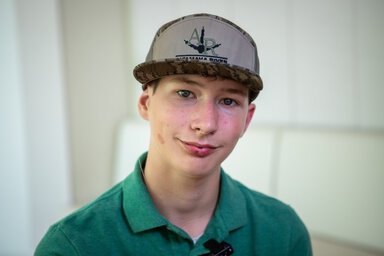 David Powell. Image wearing a hat and green polo shirt