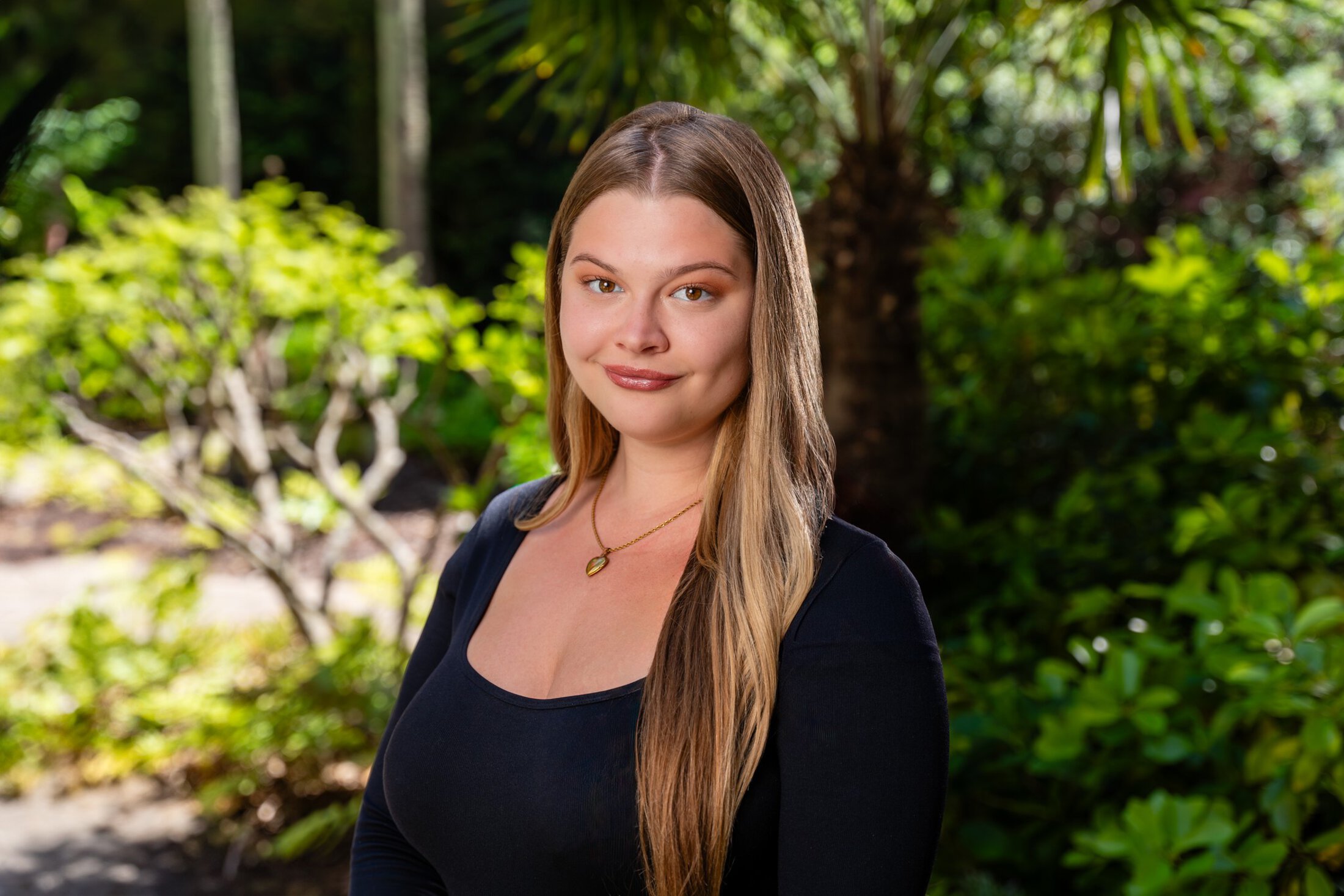 Olivia Levins headshot in a garden setting