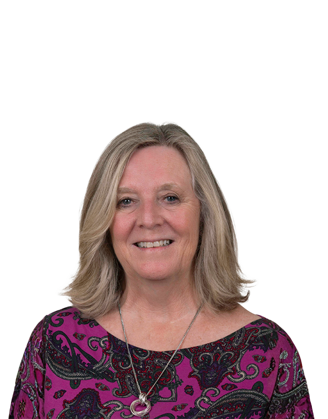 head and shoulders portrait of a female smiling at the viewer and isolated on a blank background