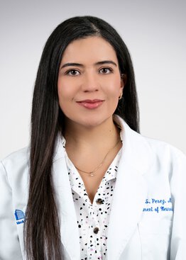 Gina Perez, MD wearing a white coat