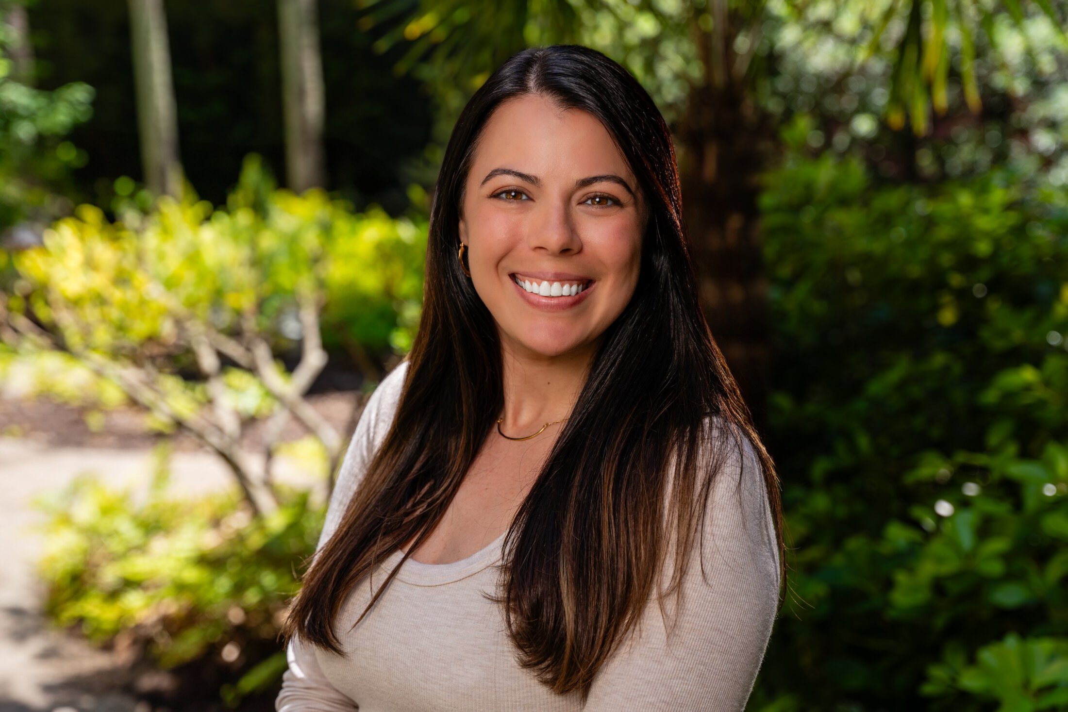 Noelle Natale headshot in a garden setting