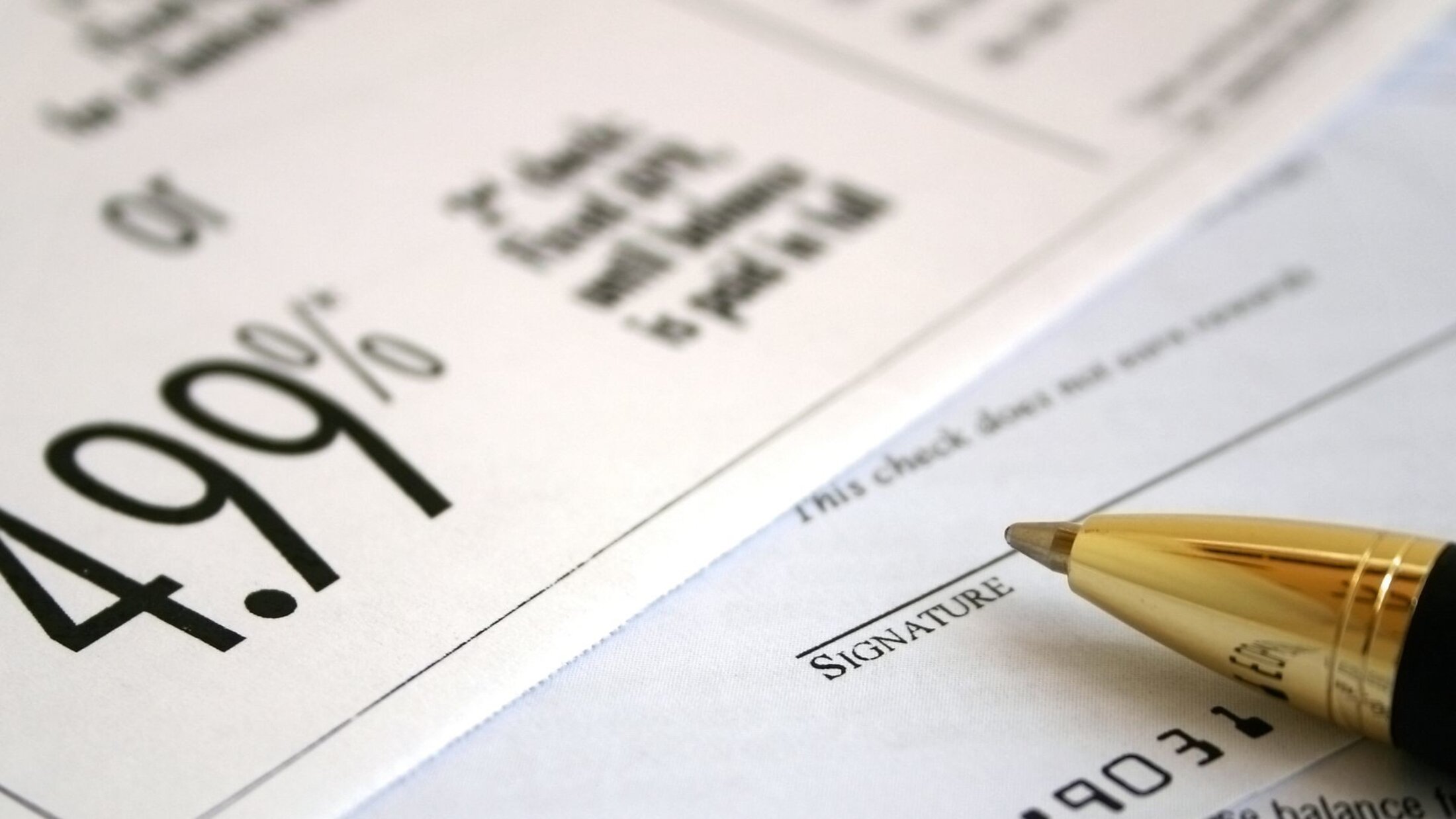 Financial agreement showing a 4.99% interest rate and signature section, illustrating borrowing and loan terms.