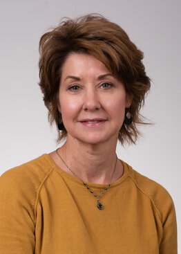 Jill Jenkins, Radiology, MHA, Instructor wearing a gold sweater