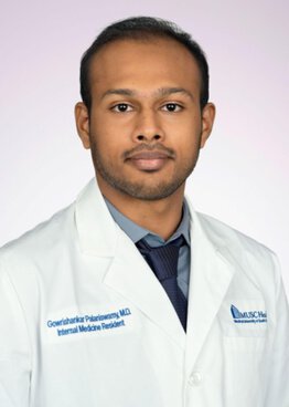 Gowrishakar Palaniswamy MD  wearing a white coat