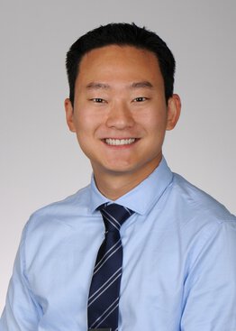 Jimmy Suh, MD, Neurology wearing a blue dress shirt and tie