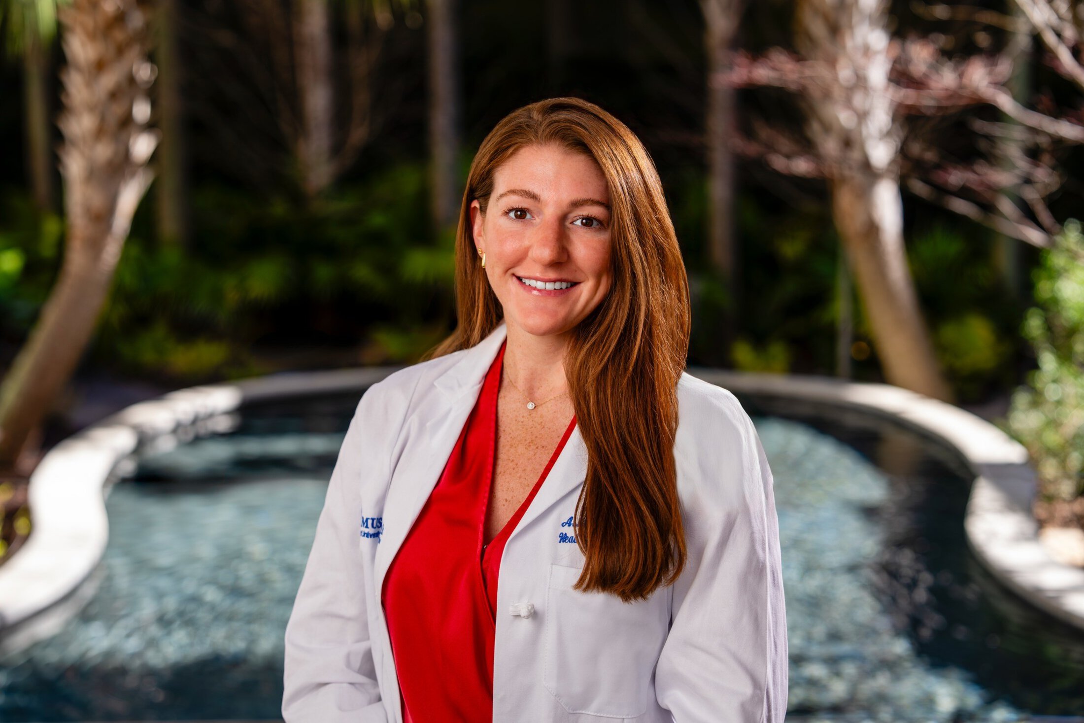 Ashton Getchell Hollings Cancer Center standing outside in lab coat