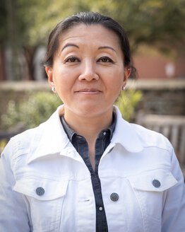 Aiko Thompson wearing a white jacket