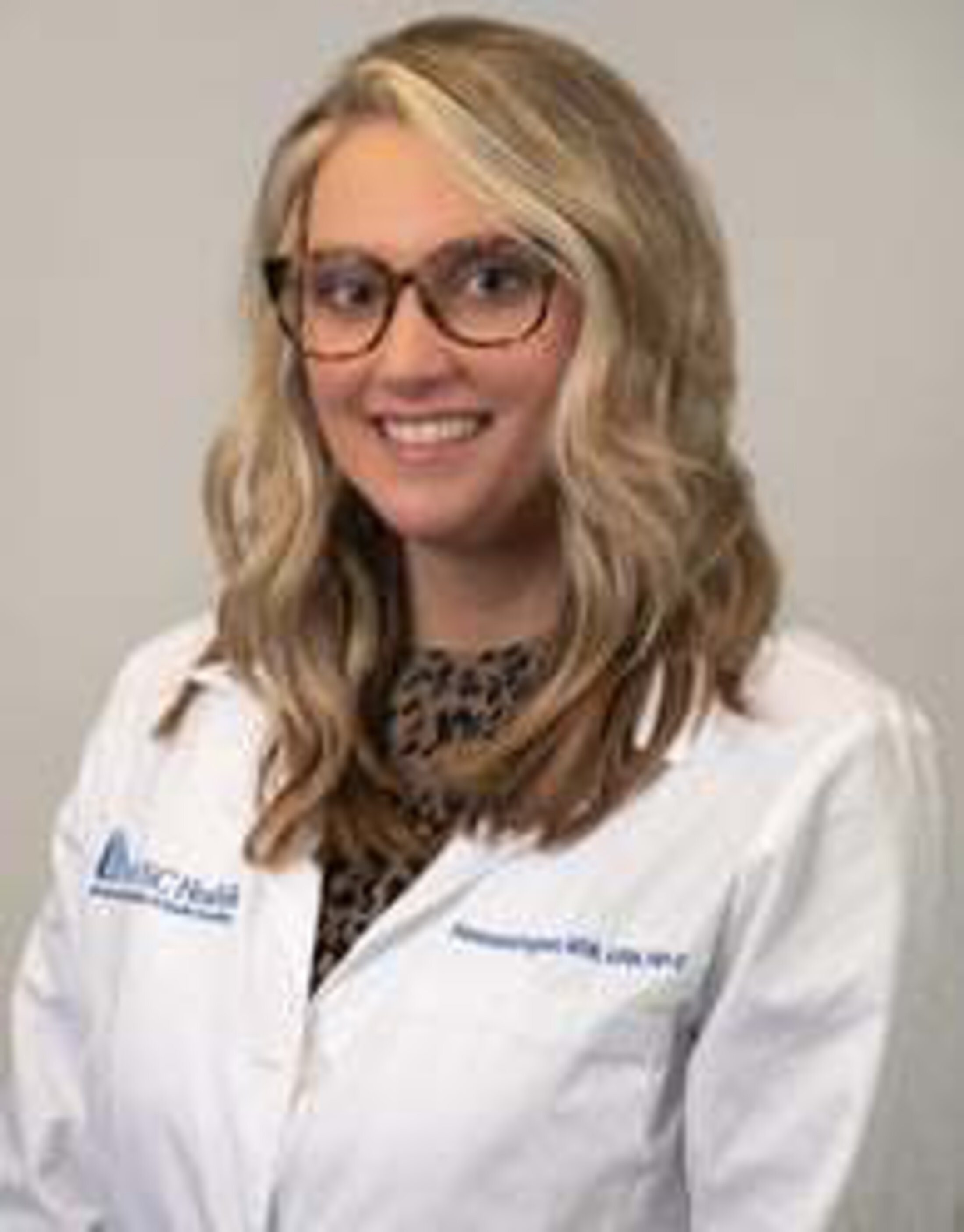 Alexandria Ingram MSN wearing a lab coat