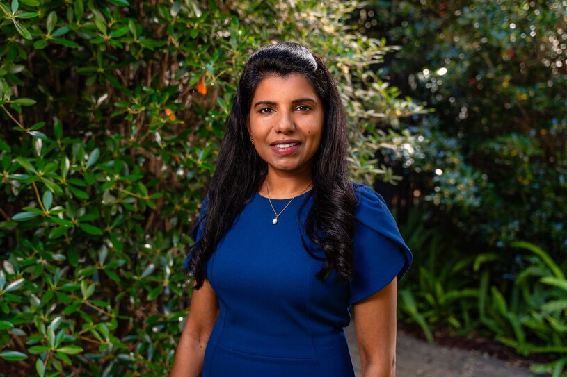 Dr. Abi Siva in the garden at Hollings.