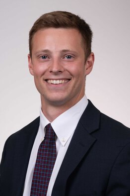 Aaron Miller, fellow wearing a suit