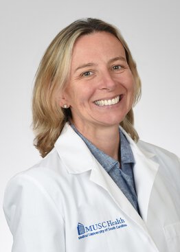 Erin K. Balog, M.D., FAAP Pediatrics Teaching Scholar wearing a lab coat