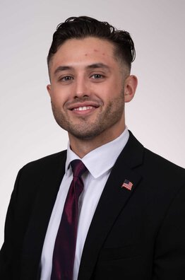 Coulter Small, fellow wearing a suit