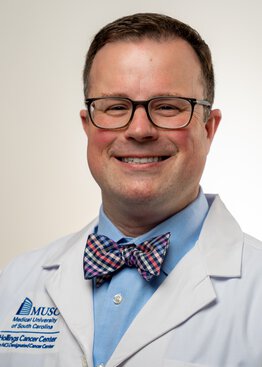 Russell Jenkins, M.D., Ph.D., wearing a white coat
