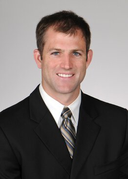 Jonathan Lena, MD, Neurosurgery, Cancer - Brain & Spine Tumors wearing a dark grey suit and a tie