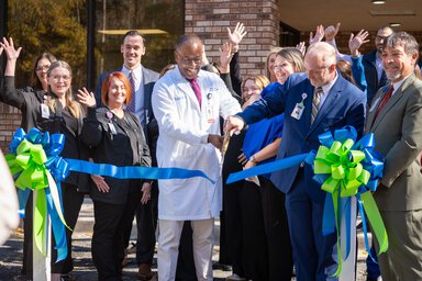 MUSC Health Lancaster Hematology and Oncology Ribbon Cutting with group outside