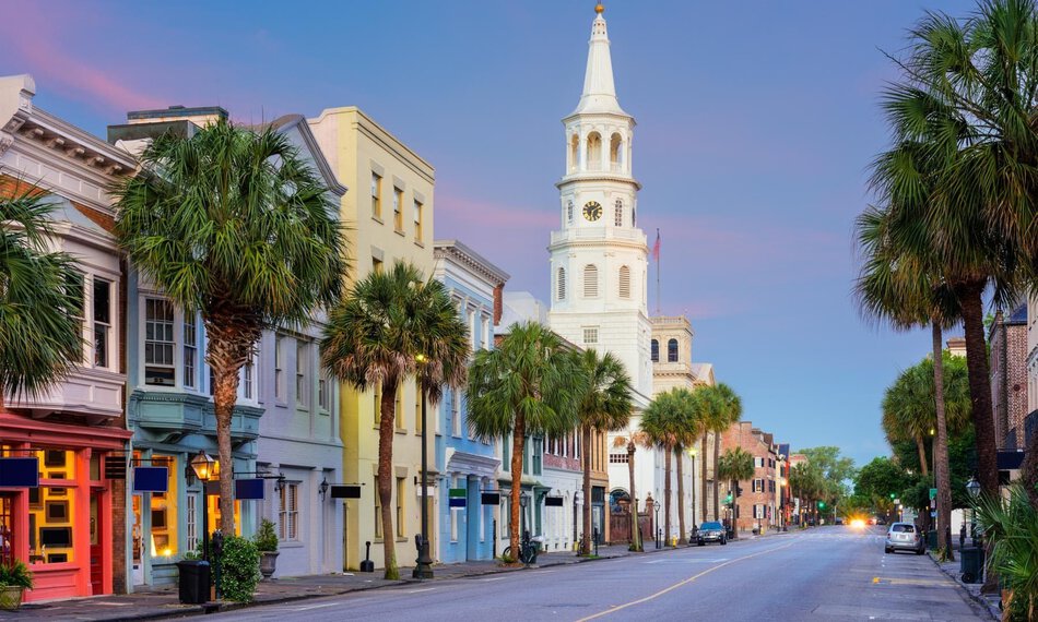 Charleston with church on King street downtown at sunset