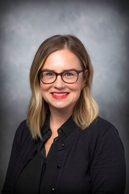 Katherine Bright, Regulatory Coordinator wearing a black sweater and dress shirt