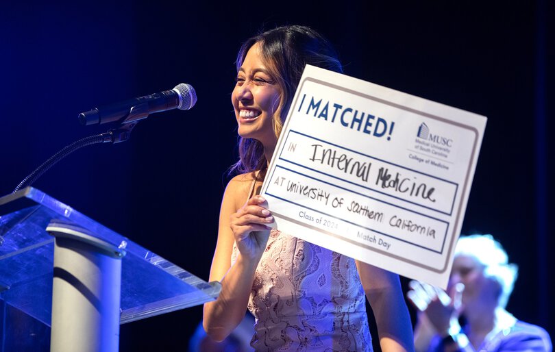 College of Medicine student holding Match Day sign