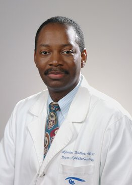 Aljoeson Walker, MD, Neurology wearing a white coat