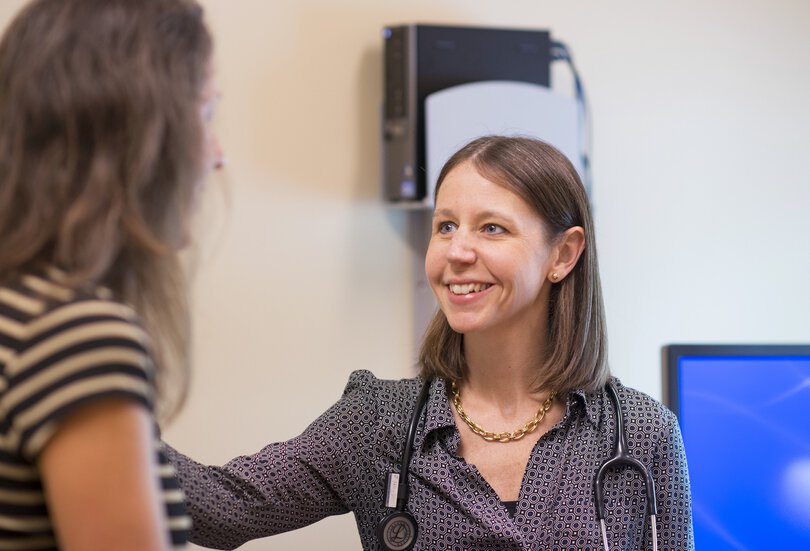 Rochelle Ringer, MD, breast surgical oncologist, with a patient.