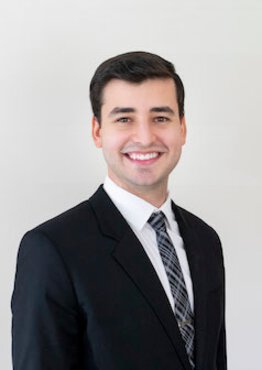 Matheus Pereira, fellow wearing a suit