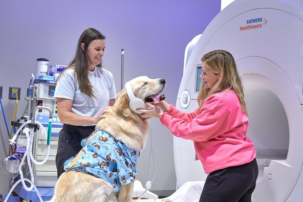 MUSC Baskin MRI wearing a blue outfit and listening to music