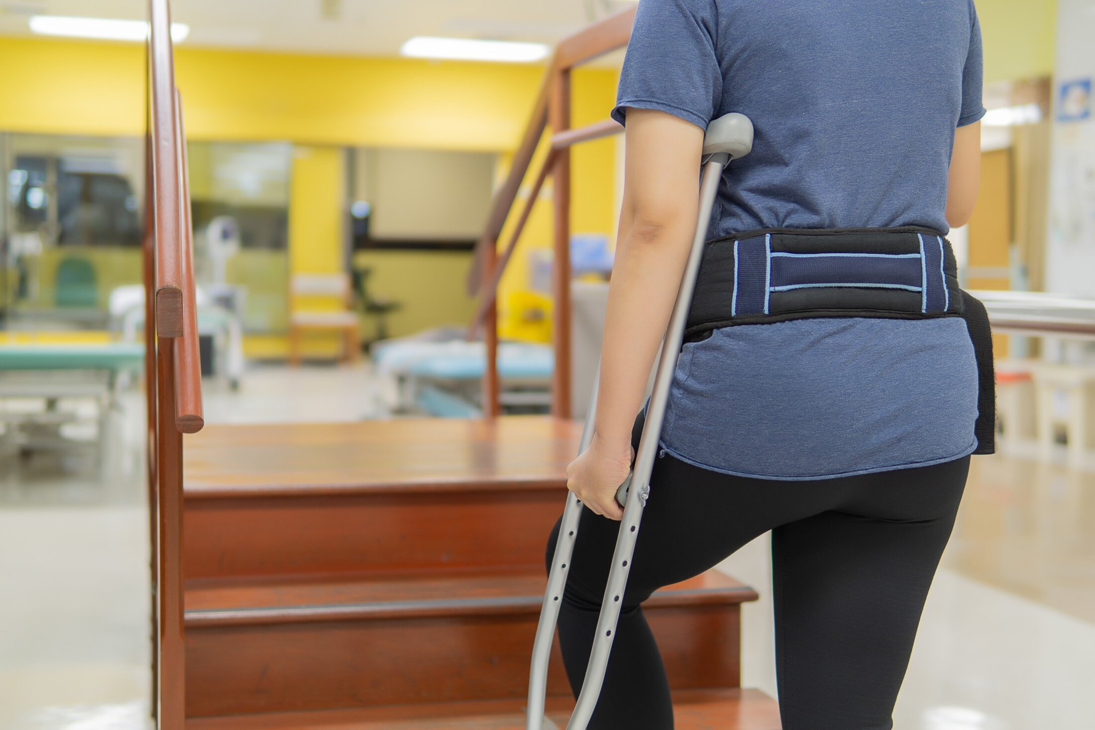 Medical and healthcare concept, Patient walk up and down with any aluminum crutches to increase safety. Wear a walking belt. Fall Protection