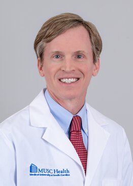 Christopher Goodier MD Obstetrics Gynecology wearing a white coat