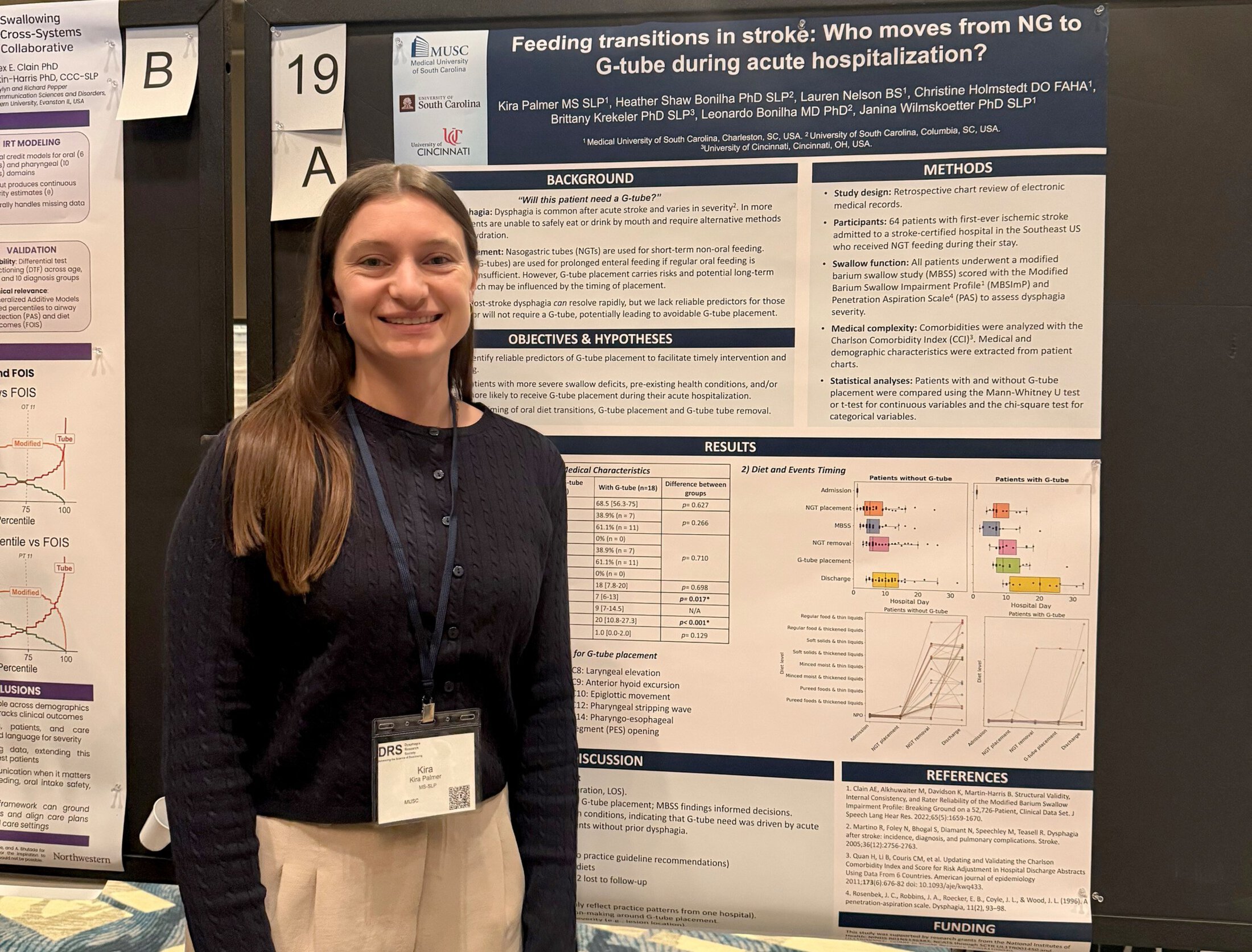 a woman stands in front of a research poster
