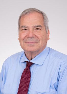 Daniel Lackland Professor Neurology Faculty wearing a blue shirt with a red tie
