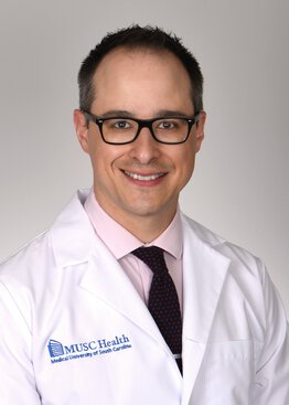 Barry Gibney, DO, Cardiothoracic Surgery,Cancer - Lung & Thoracic wearing a white coat