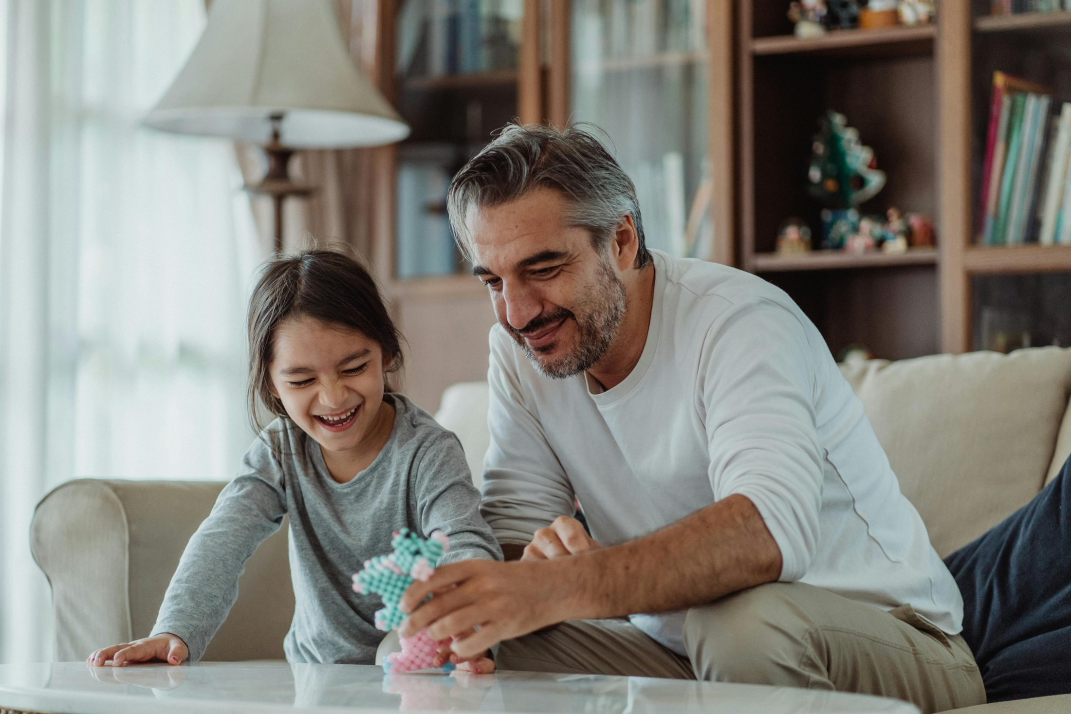 man and child laughing